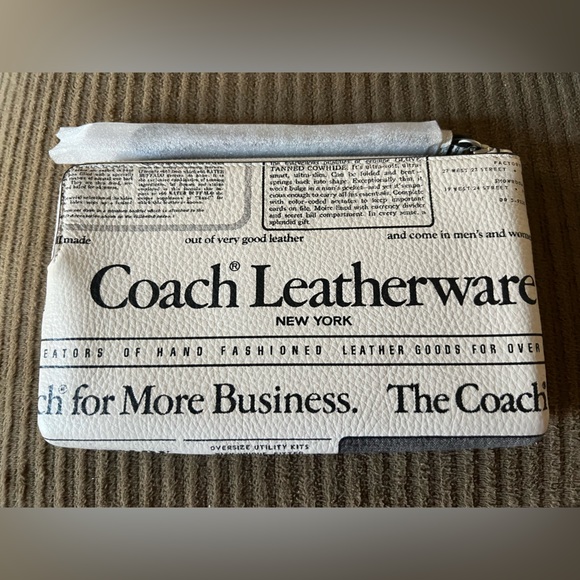 Coach Handbags - Coach Large Corner Zip Wristlet
With Newspaper Print NWT w/packaging
